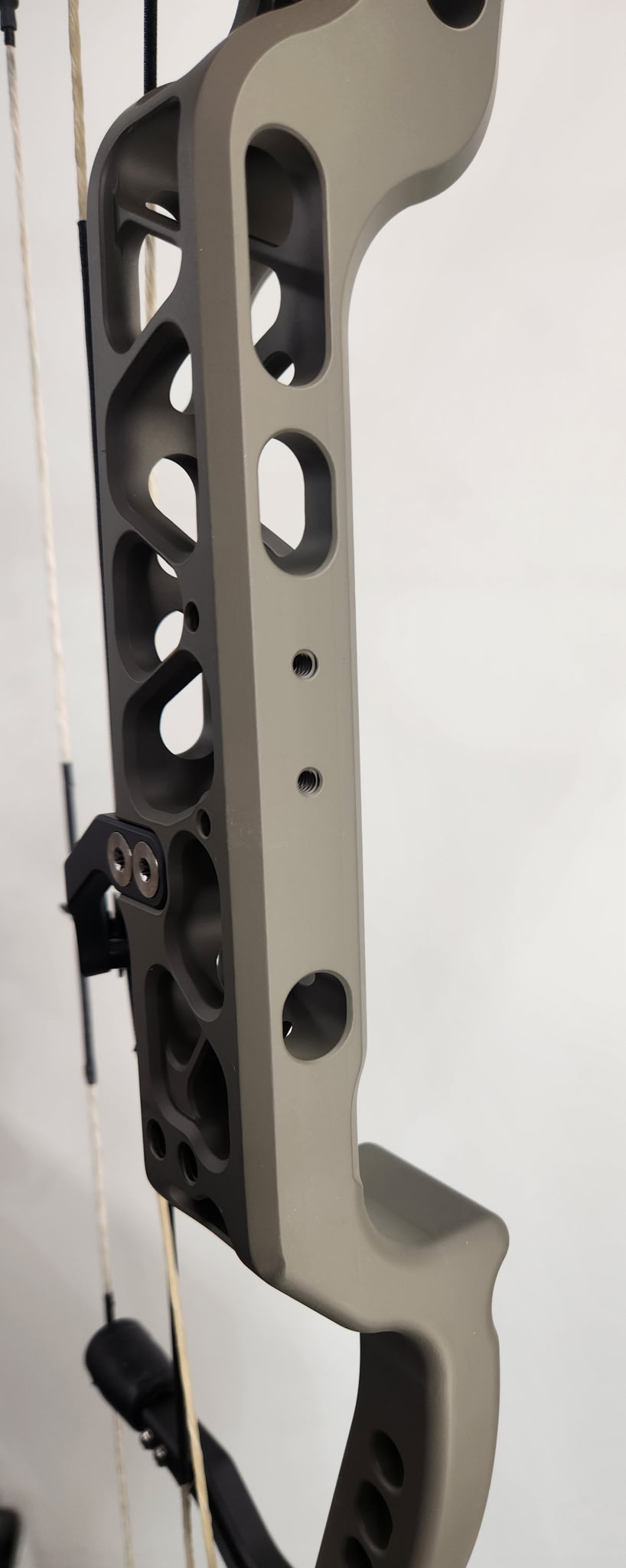 Fusion Archery riser detail — rest mount and grip